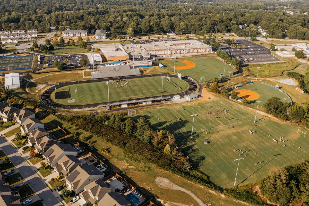 Aerial view of a school campus with athletic fields and facilities